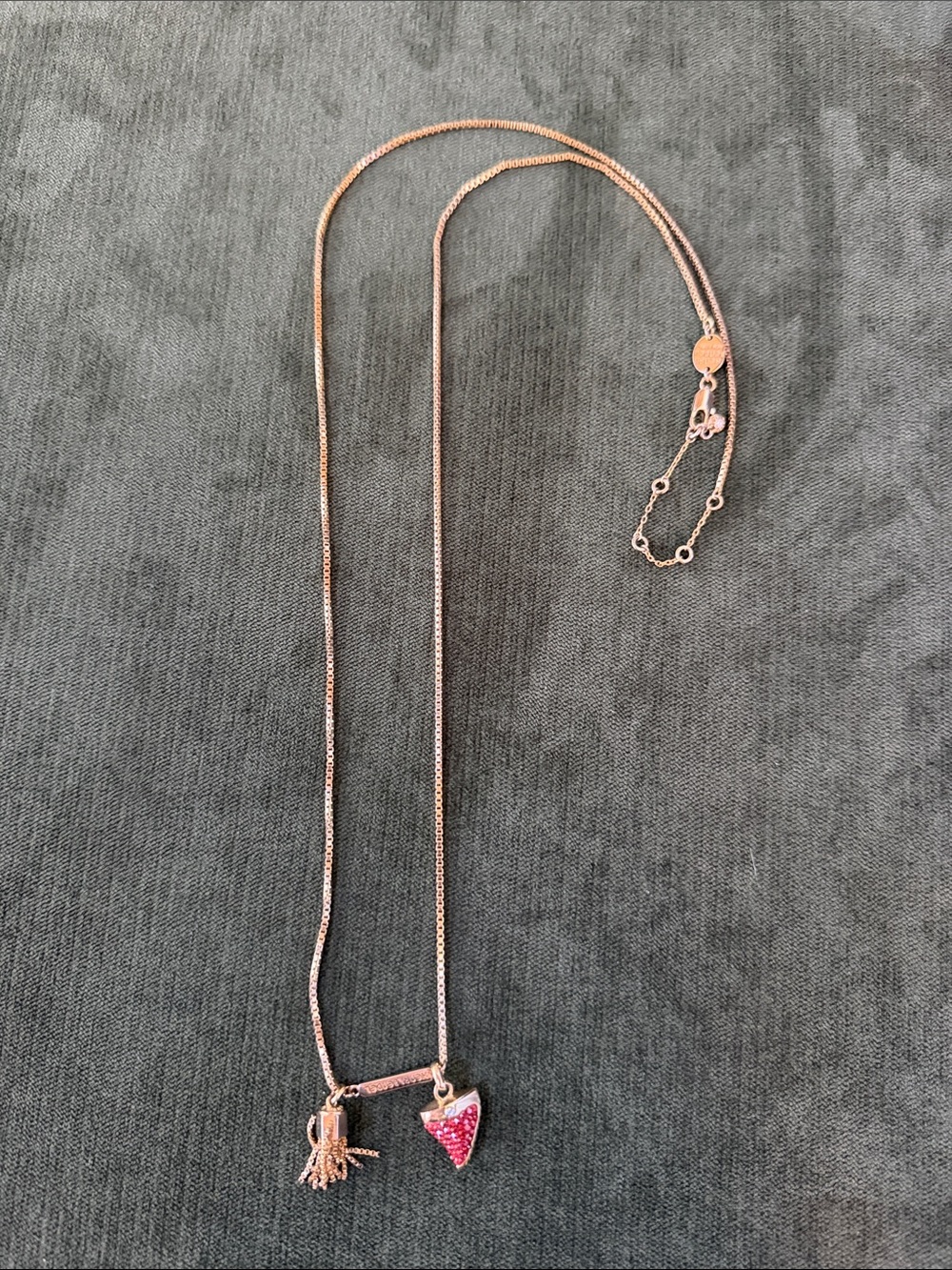 henri bendel Rose Gold Tone Necklace with red shark tooth and Tassel Charm